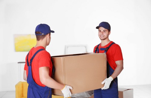 Removal van and packed boxes for a home move in Harringay