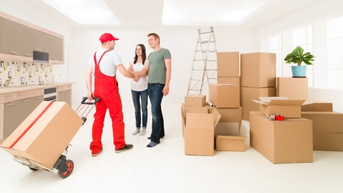 Local movers loading furniture in a North London street
