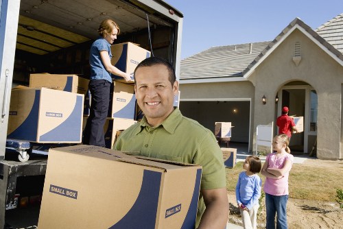 Packed moving boxes and furniture prepared for a local relocation