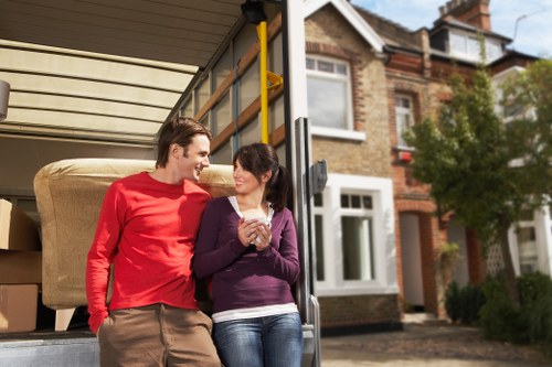 Team preparing a local home move with boxes and furniture in Harringay